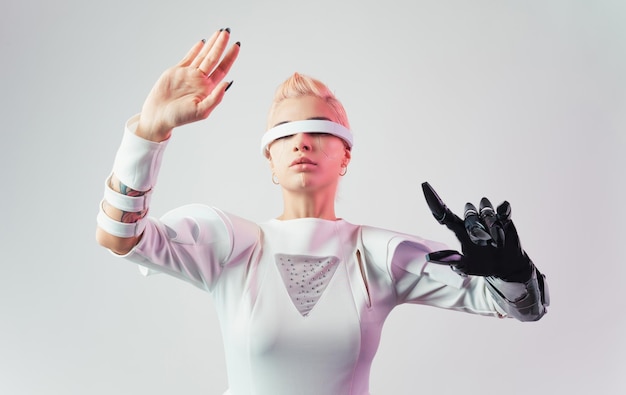 portrait of young woman with arms raised against white background