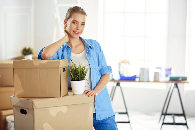 Portrait of a young woman with boxes