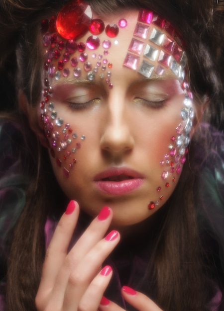 Portrait of young woman with creative visage, halloween picture.