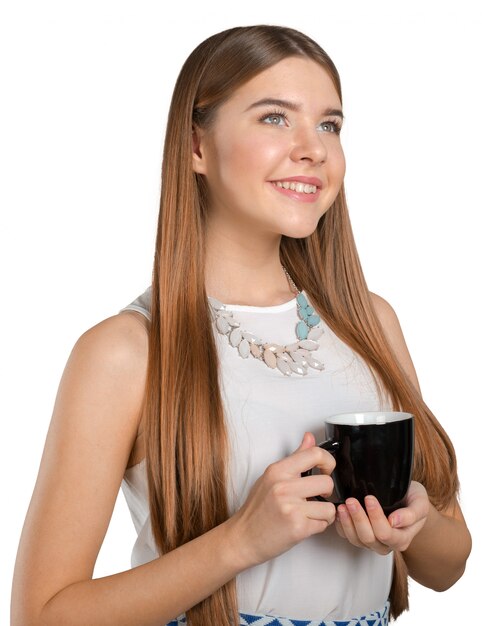 Portrait of a young woman with cup of tea or coffee