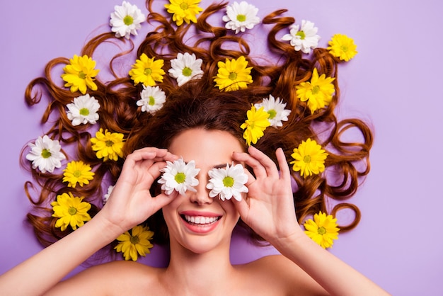 Portrait young woman with flowers in hair