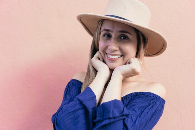 Portrait of young woman with hat