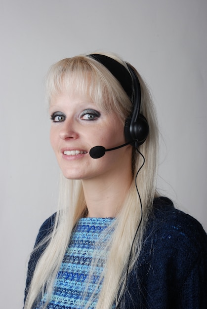 Portrait of young woman with headset