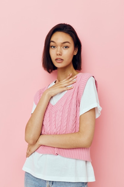 Portrait of a young woman with short hair and a pink sweater Lifestyle unaltered