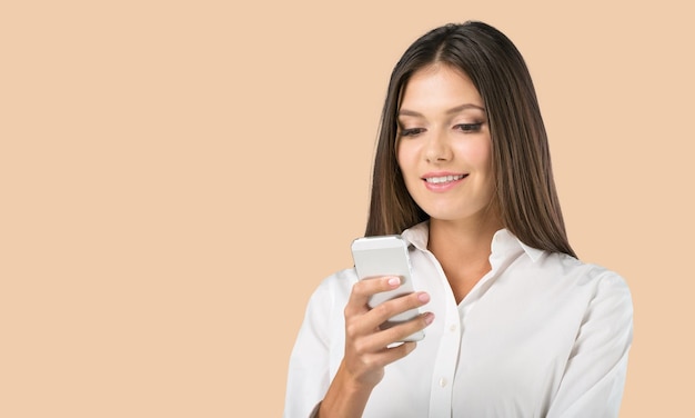 Portrait of an young woman with smartphone