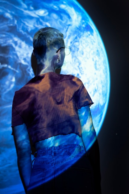 portrait of young woman with universe projection texture