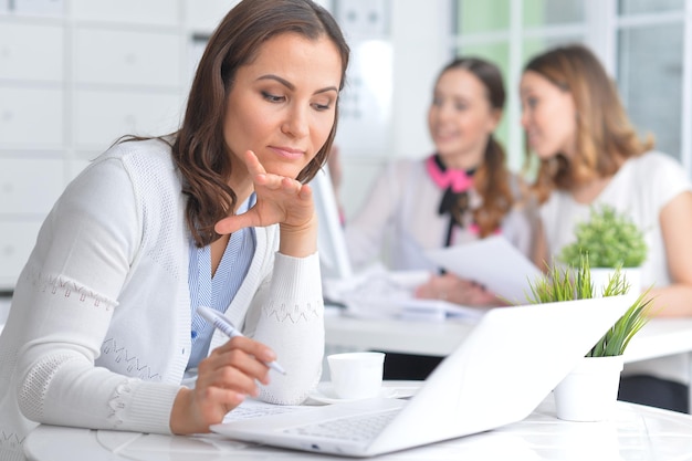 Portrait of young women working in modern office