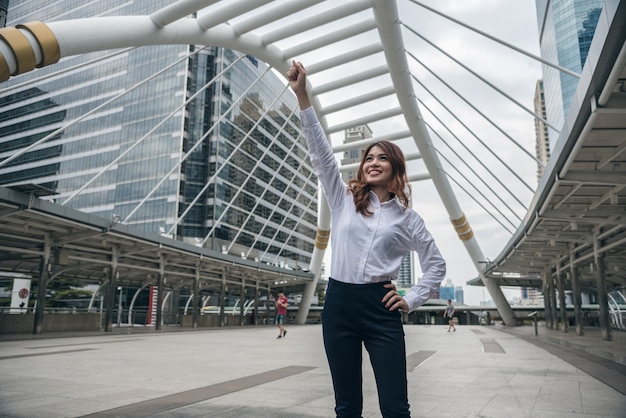 Portraits of beautiful asian woman look cheerful and confidence is standing in outdoors