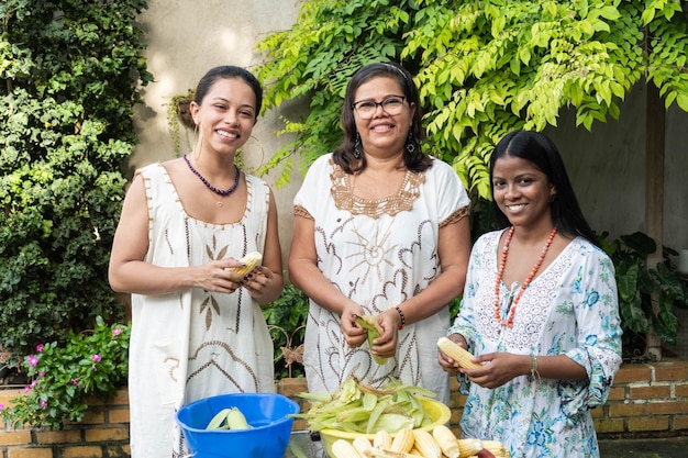 Portraits of Women Shelling Corn