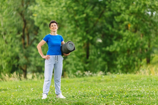 Portret of Senior Woman Exercising In Park.