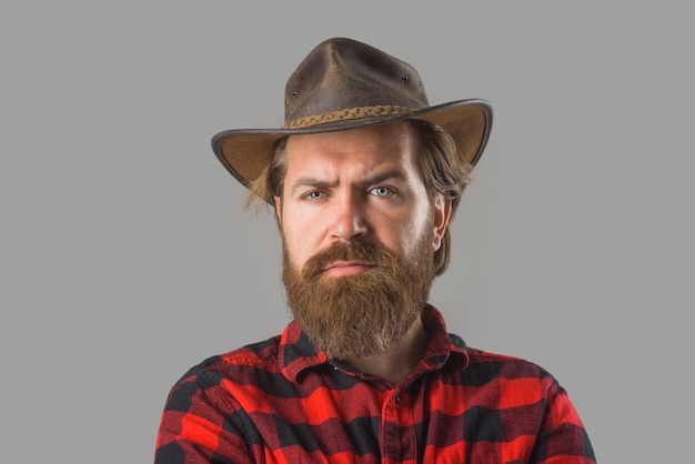 Portret van bebaarde cowboy bebaarde macho Amerikaanse cowboy cowboy met hoed westerse leven bebaarde man