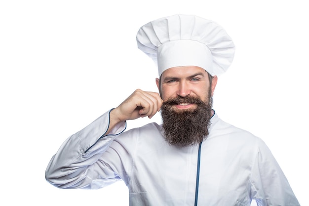 Portret van een gelukkige chef-kok kok hoed bebaarde chef-kok koks of baker bebaarde mannelijke chef-koks geïsoleerd op wit grappige chef-kok met baard kok baard man en snor dragen slabbetje schort luier man