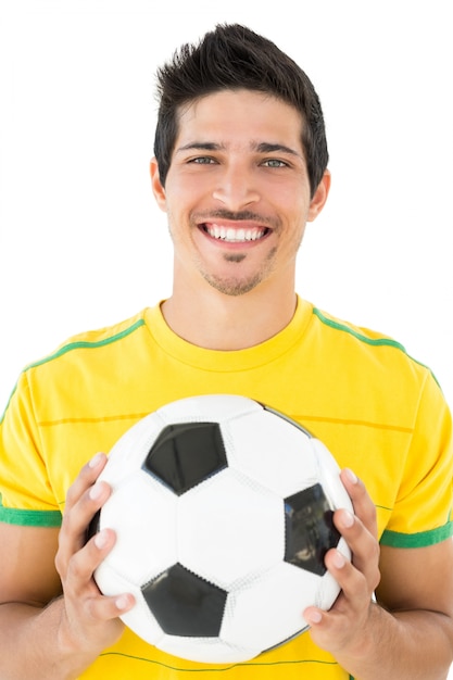 Portret van een glimlachende knappe voetbalster