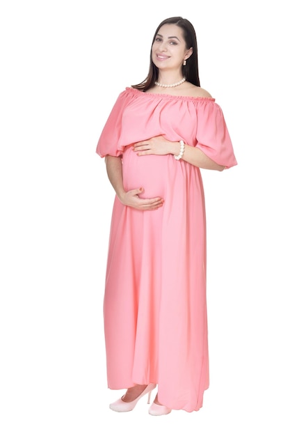 Portret van een mooie zwangere vrouw in roze jurk