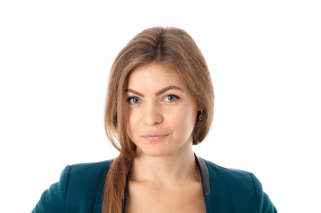 Portriat of young business woman in blue jacket looking at the camera isolated on white background