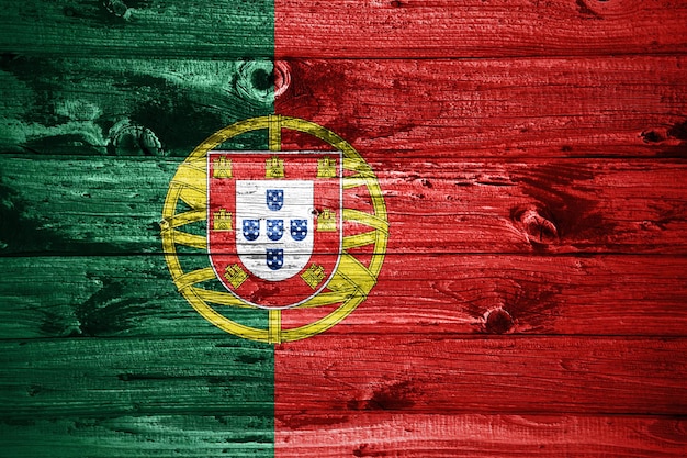 Portugal flag on wooden planks background wood flag