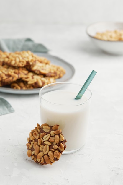 Portugues traditional peanut cookie known as bolachas de amendoim with a glass of milk