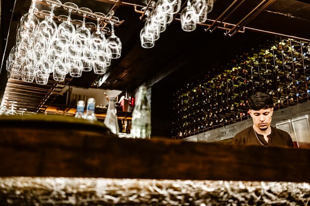 Portuguese barman working in the bar and preparing drinks Porto