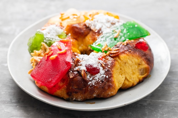 Portuguese fruit cake Bolo rei on the dish