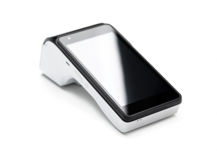 Photo pos terminal device for reading banking cards isolated on white wall