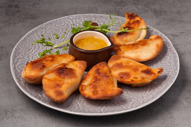 Posikunchiki  small pies with meat and mustard sauce
