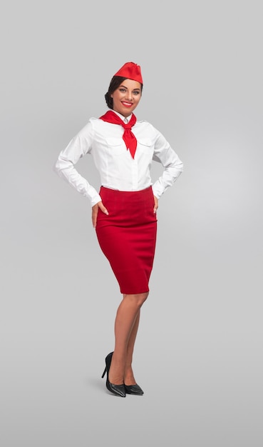 Positive air hostess smiling for camera