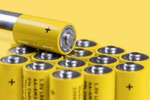 Positive ends of yellow alkaline aa batteries recycling of\
rechargeable batteries selective focus