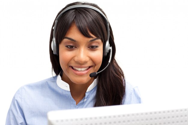 Photo positive ethnic customer service representative using headset