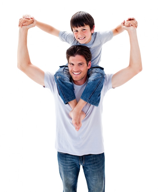 Positive father giving his son piggyback ride