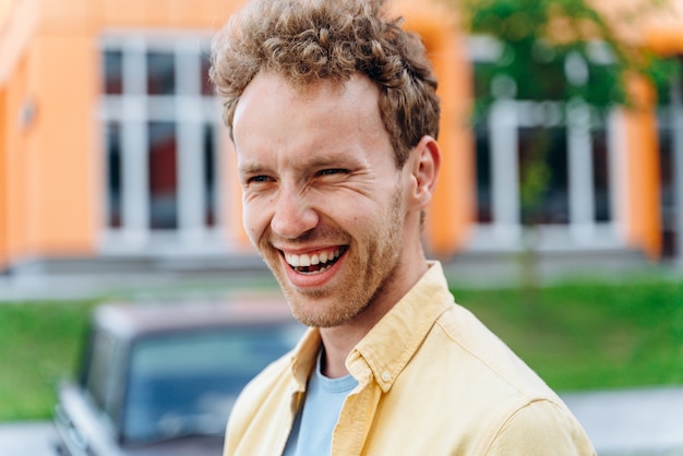 positive guy on the background of the city