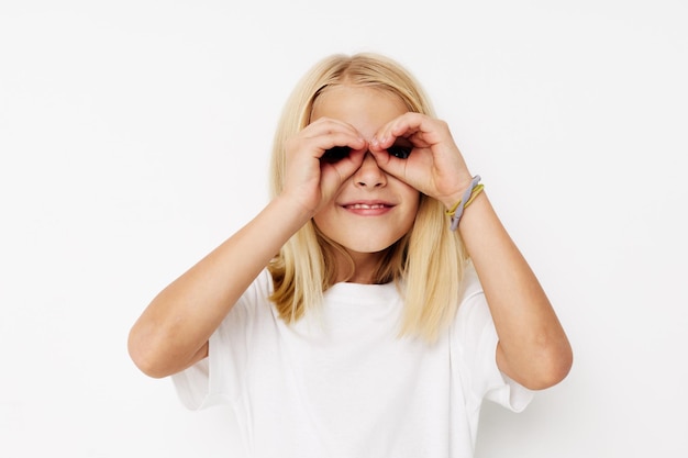 Positive little girl hand gesture fun fashion posing\
studio