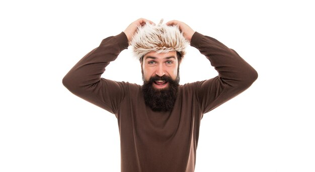 positive mature guy with beard in earflape hat isolated on white background fashion