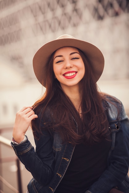 Positive portrait of a stylish girl