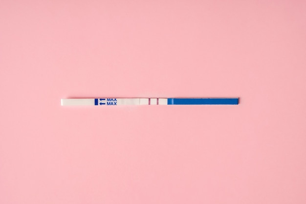 A positive pregnancy test on a background Minimalism and a place for text