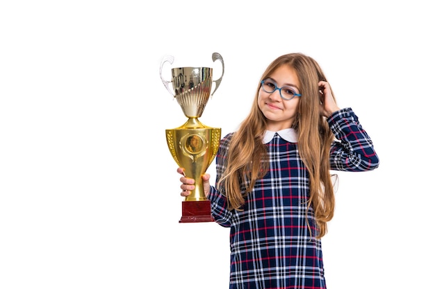 Positive school girl winning excellent award photo of excellent school girl with award