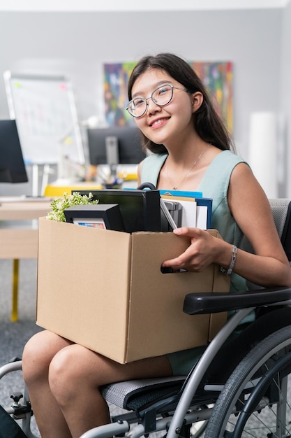 Positive smiling cheerful attractive young women with glasses has disability who use a wheelchair