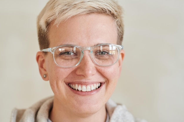 Positive tomboy girl in glasses