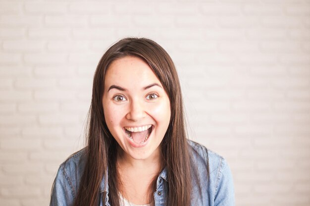 positive woman smiling on a light background