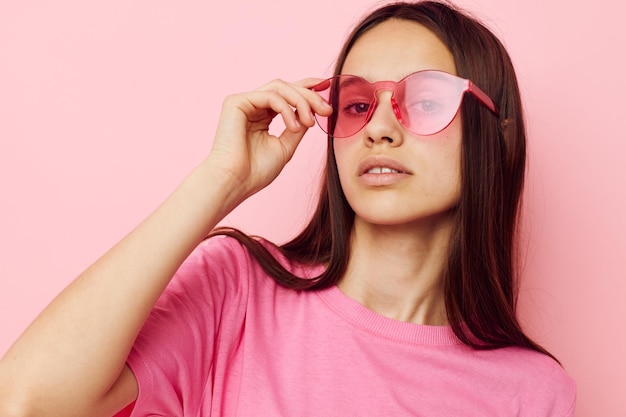 Positive woman in stylish glasses posing emotions cropped view