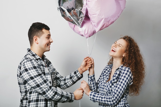 Photo positive young female doesn't expect to receive present from boyfriend.