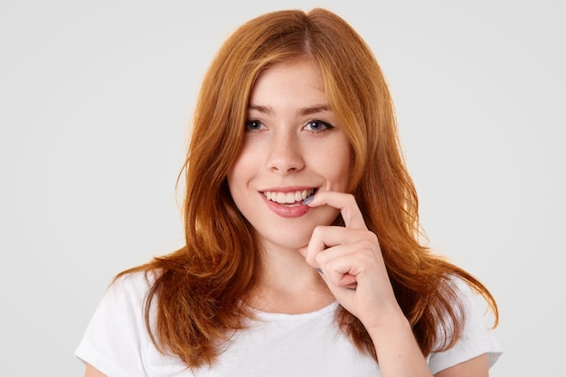 Positive young female with freckled skin