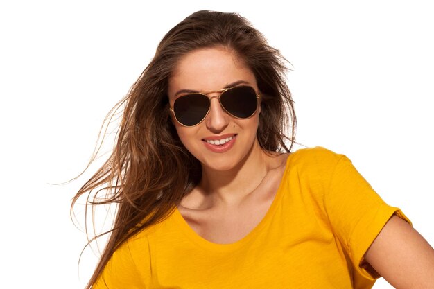 Positive young woman in sunglasses