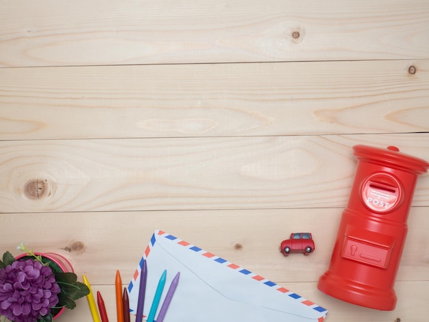 Post envelope letter and balloon on wooden table