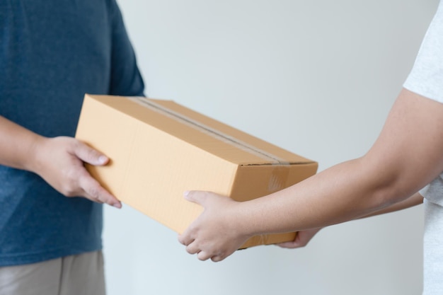 Postal service sending paper cardboard box to customer shipping service