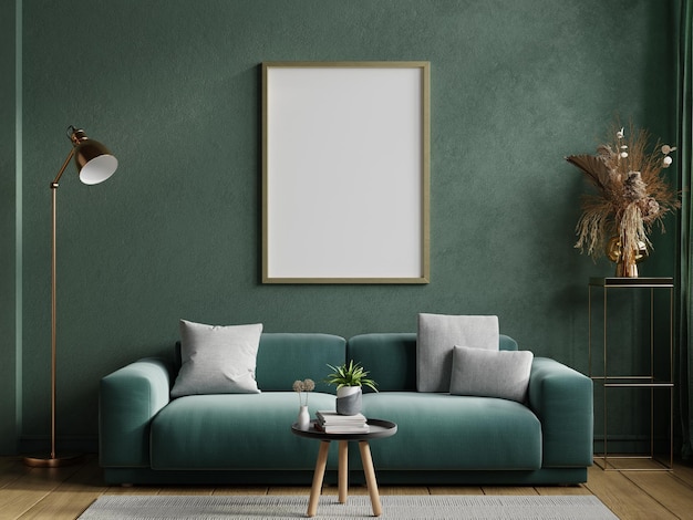 Poster mockup with vertical frame on empty dark green wall with green velvet sofa