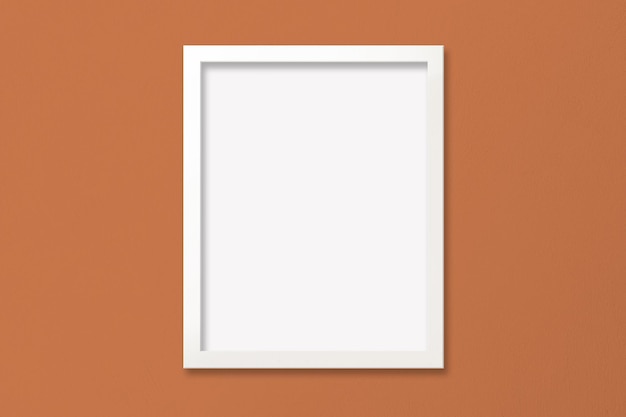 Макет плаката с белой рамкой на оранжевой текстурированной стене