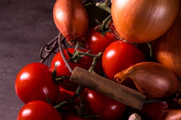 Poster of an old basket with onion garlic tomatoes to decorate the kitchen