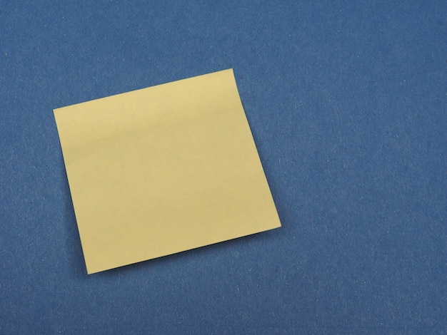 Postit over blue with copy space