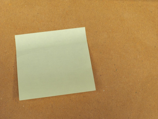 Postit over brown with copy space