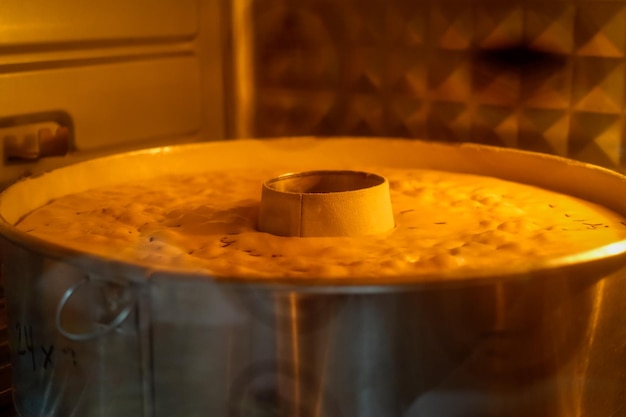 A pot of food is being cooked in a kitchen.